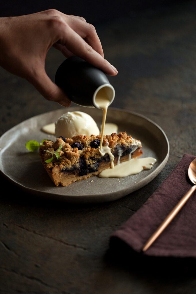 Blueberry Jam on top of short crust tart and white chocolate