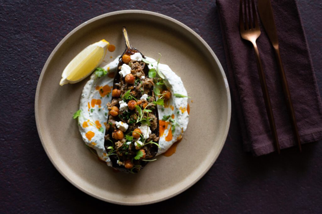 Perfectly Roasted Eggplant on top of dill yogurt